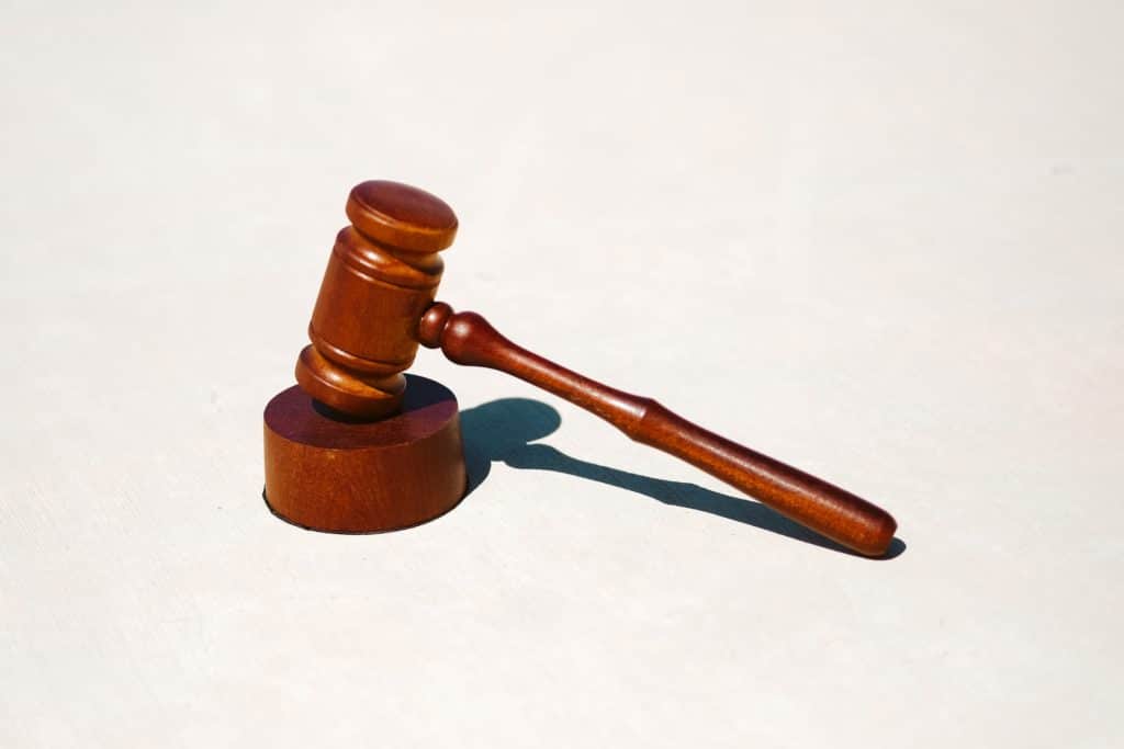 a wooden gavel on a white background. 