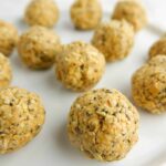 Peanut butter bliss balls on white plate.