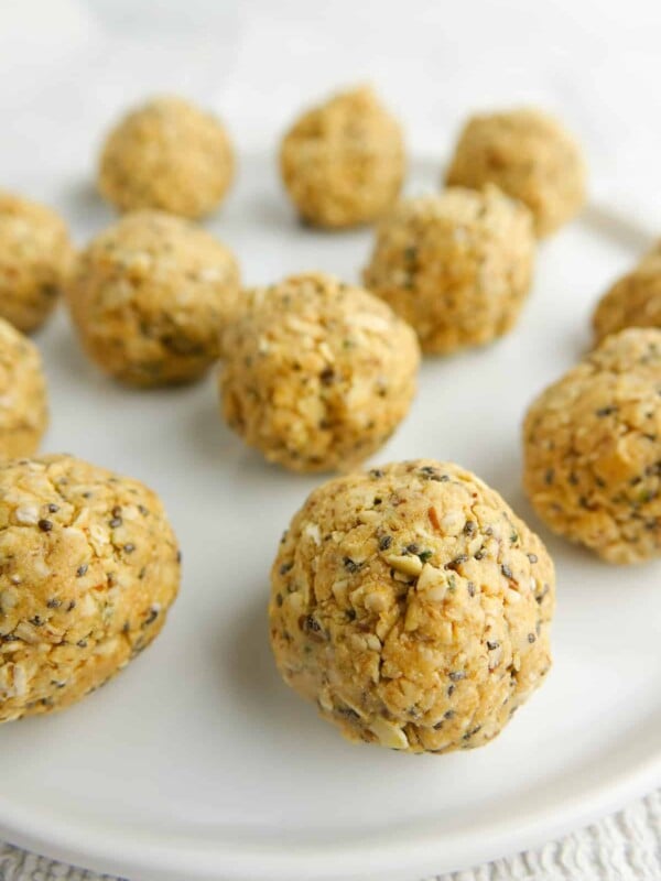 Peanut butter bliss balls on white plate.