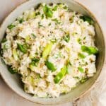 Rotisserie chicken salad in a bowl, garnished with green onions
