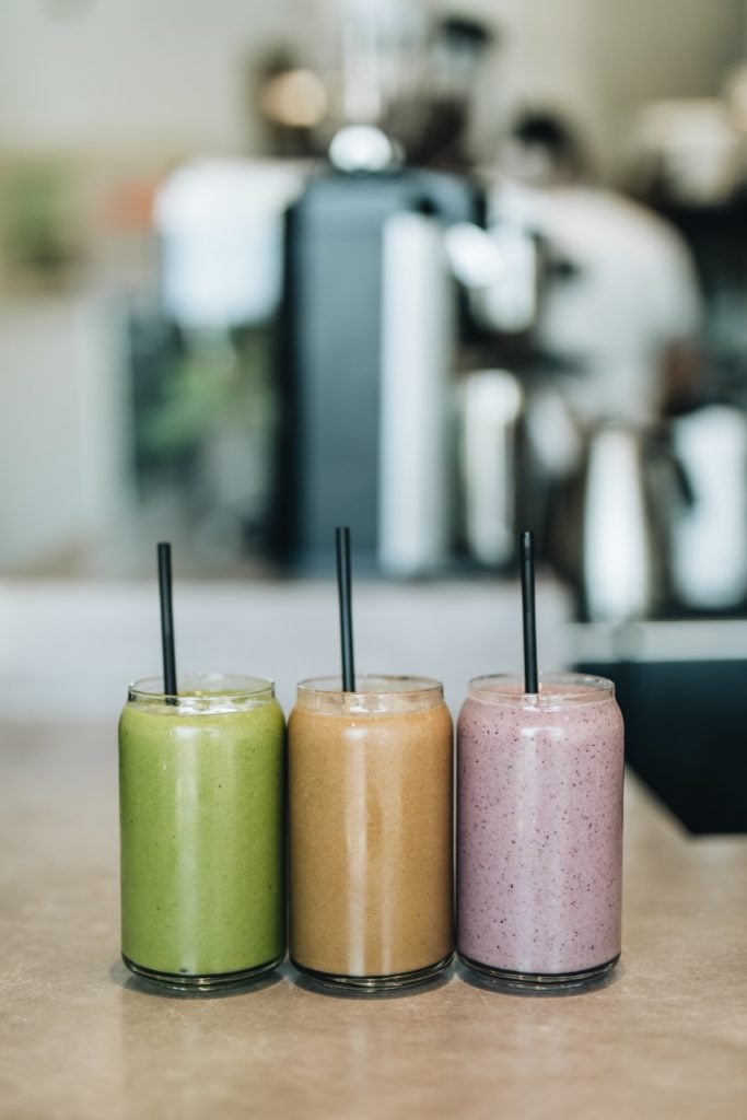 Free Photo  Three various juices in glass cups with straw.