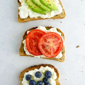 3 pieces of sweet and savoury toast with cottage cheese on a white marble counter.