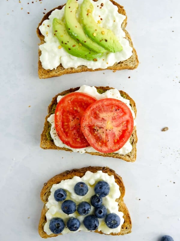 3 pieces of sweet and savoury toast with cottage cheese on a white marble counter.