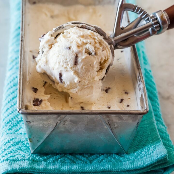 chocolate chip ice cream being scooped from cake pan