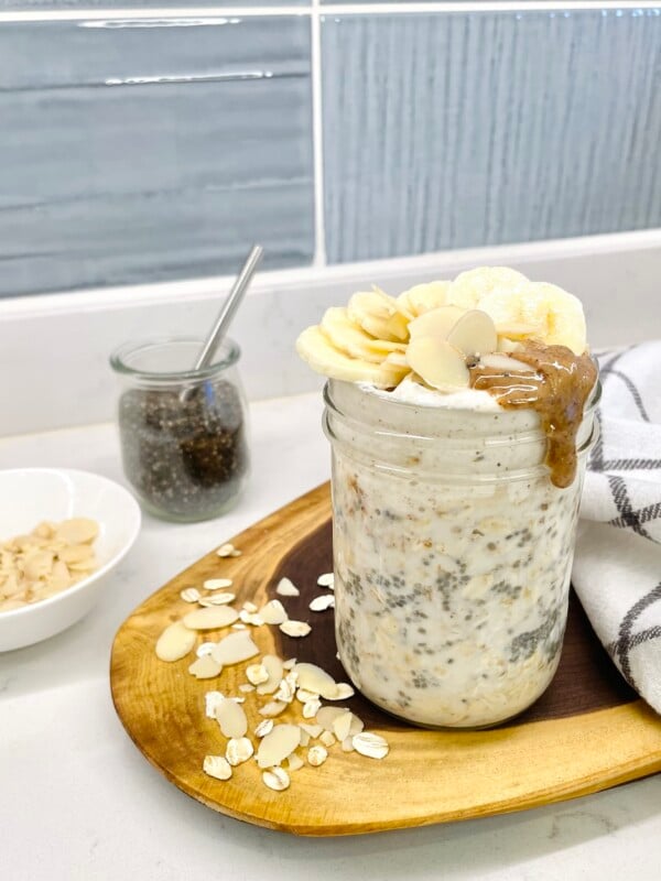 jar of almond butter overnight oats on a kitchen counter