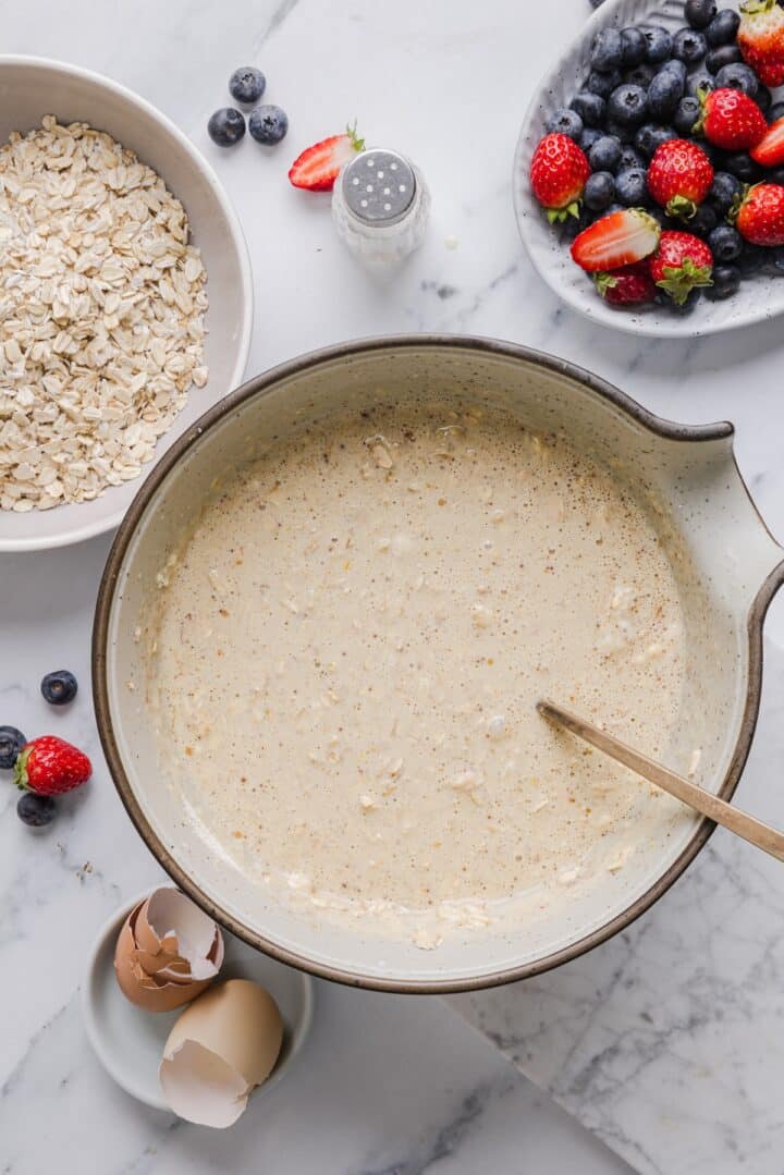 Batter for protein baked oats in a large mixing bowl.