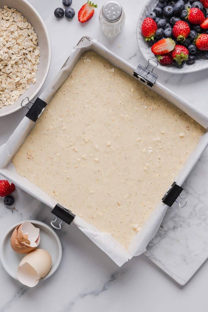 Raw protein baked oatmeal in a baking pan.