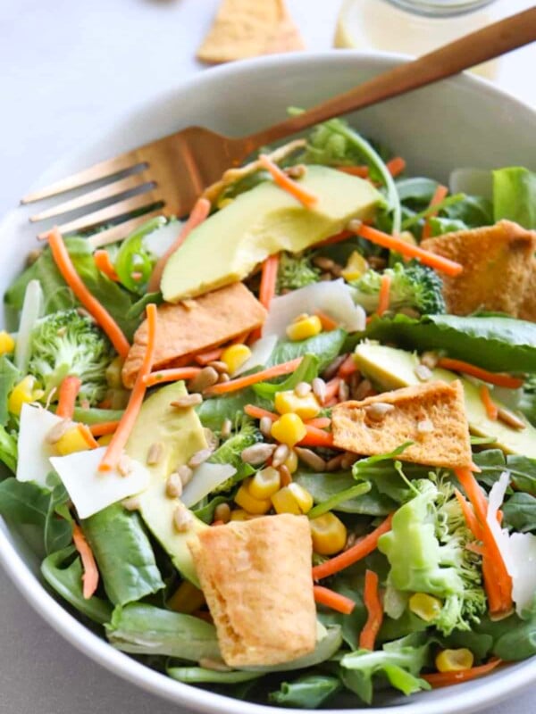 Mandy's the fave salad copycat recipe in a white bowl with a gold spoon