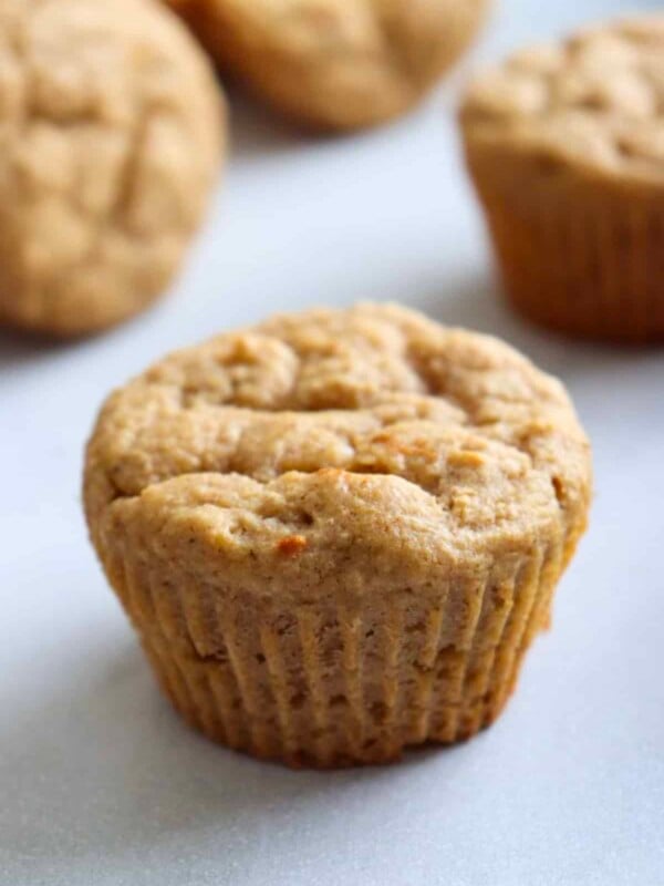 kodiak cakes muffins made with applesauce on a white kitchen cupboard