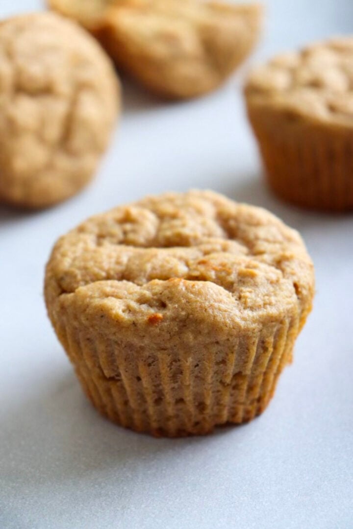 kodiak cakes muffins made with applesauce on a white kitchen cupboard