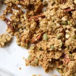 Salted honey nut granola clusters on a sheet pan