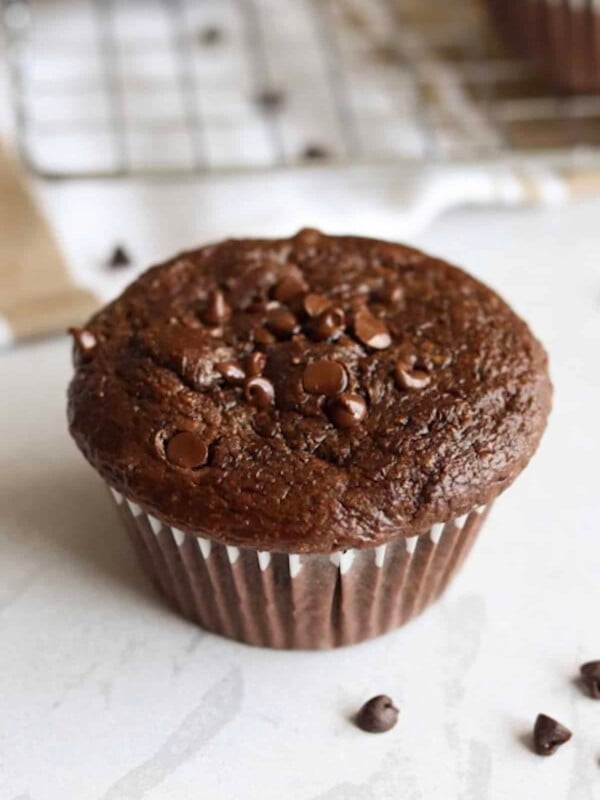 Double chocolate cottage cheese muffin on a white kitchen counter