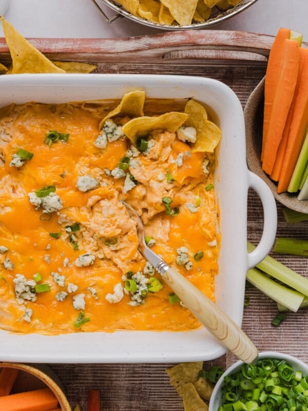 Creamy buffalo chicken dip with cottage cheese in a square baking dish.