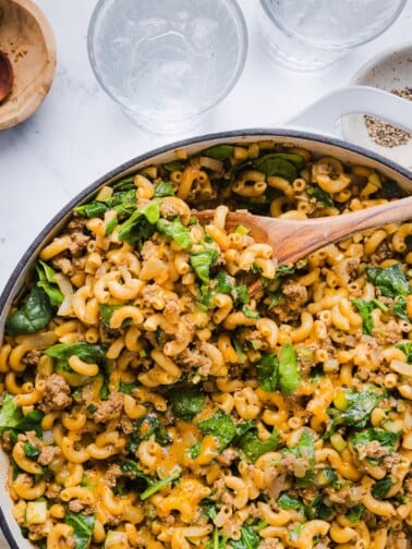 Healthier hamburger helper with spinach in a large pot