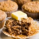 Honey bran muffin with a pat of partially melted butter on top