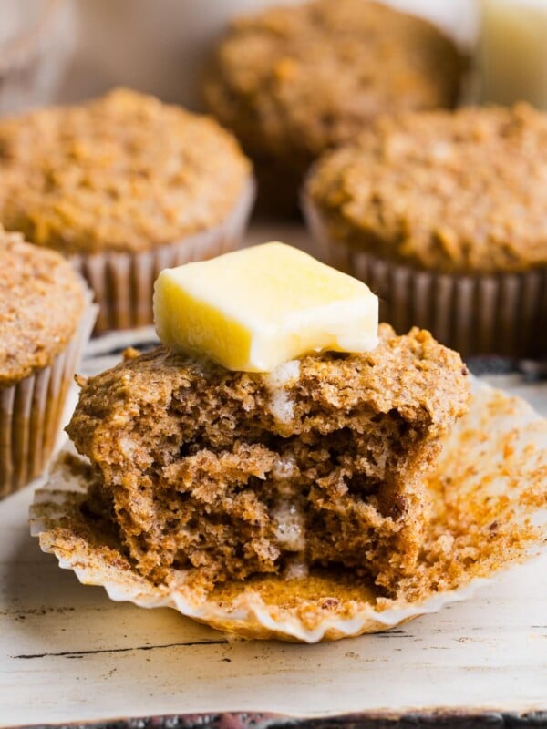 Honey bran muffin with a pat of partially melted butter on top