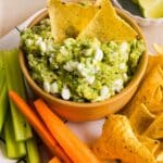 Cottage cheese guacamole served with tortilla chips and sliced vegetables