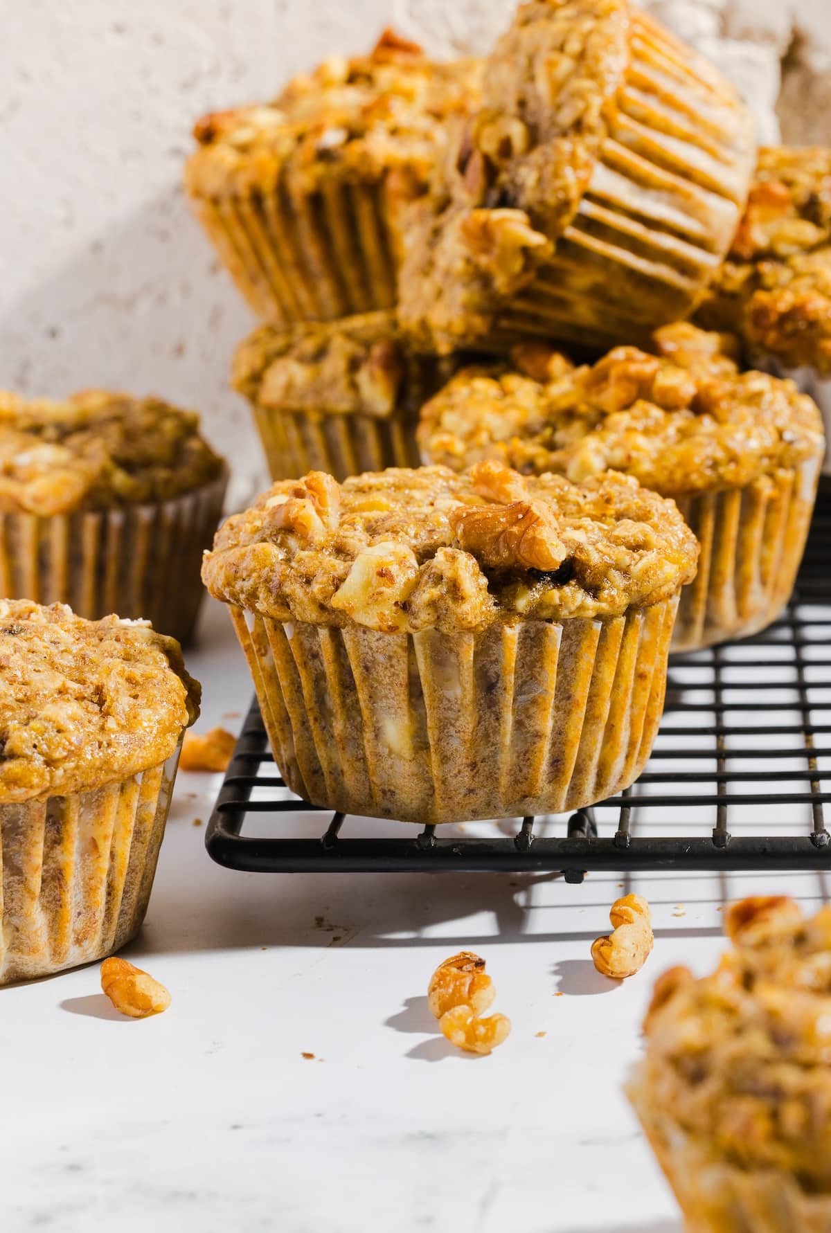 Banana cottage cheese muffins on a wire cooling rack.