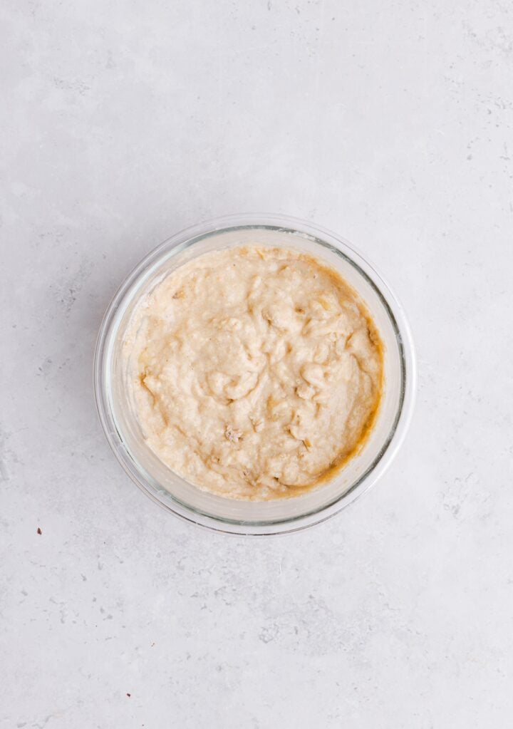 Pancake batter in a small glass, oven-safe bowl