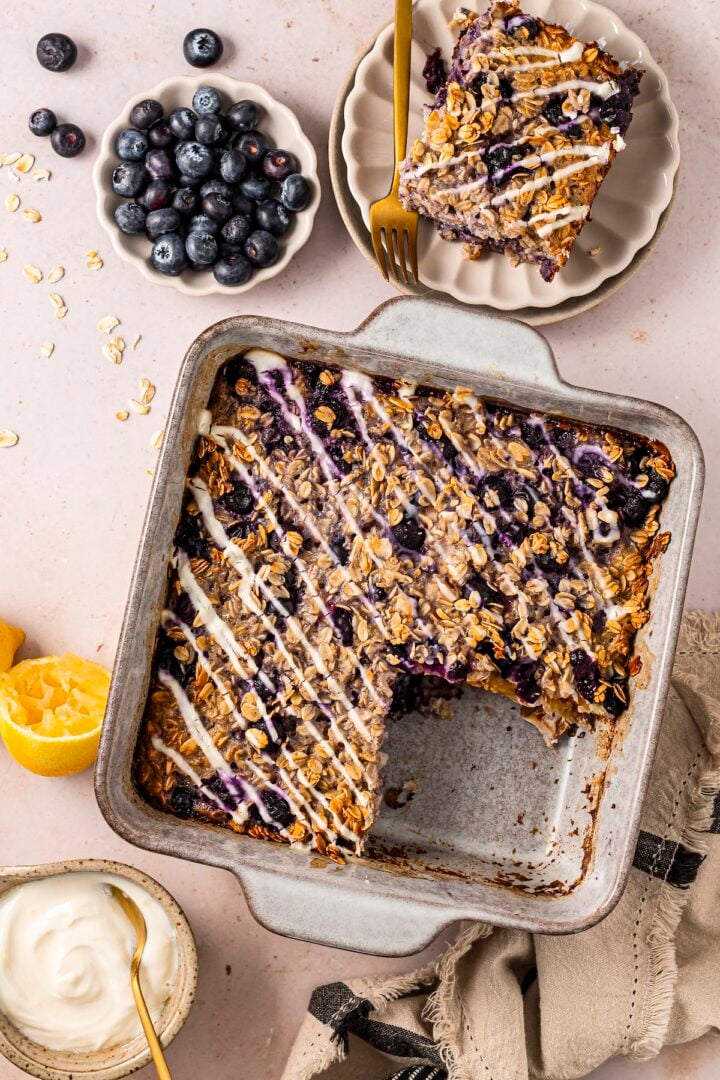  Baking pan with lemon blueberry baked oats, with one square taken out of the corner