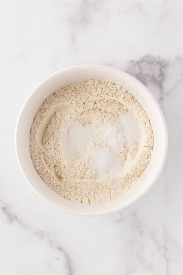 Dry ingredients for chocolate chip cookies whisked in a bowl