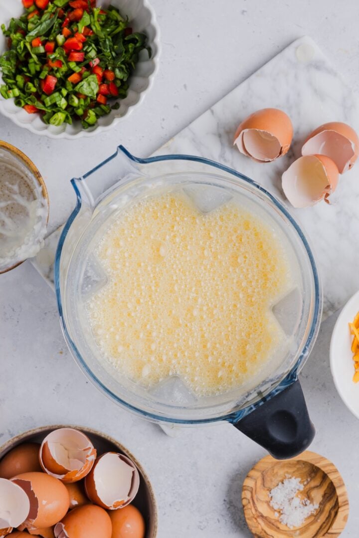 Eggs and cottage cheese blended in a large blender.