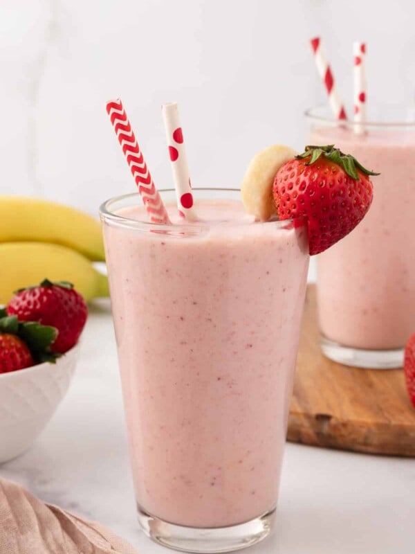 Two glasses filled with strawberry banana smoothie without yogurt