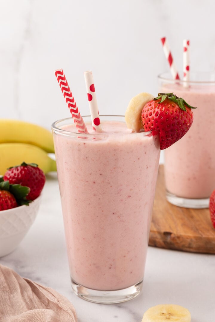 Two glasses filled with strawberry banana smoothie without yogurt