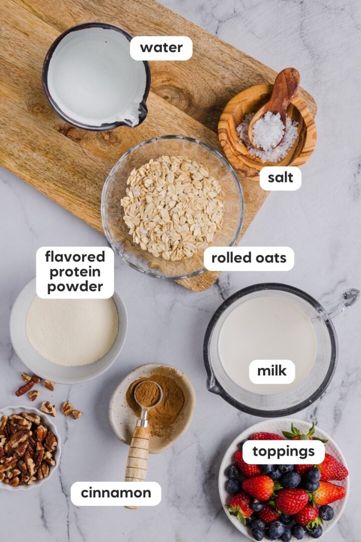 Overhead, labelled photo of ingredients in protein oatmeal, warm and made on the stovetop.