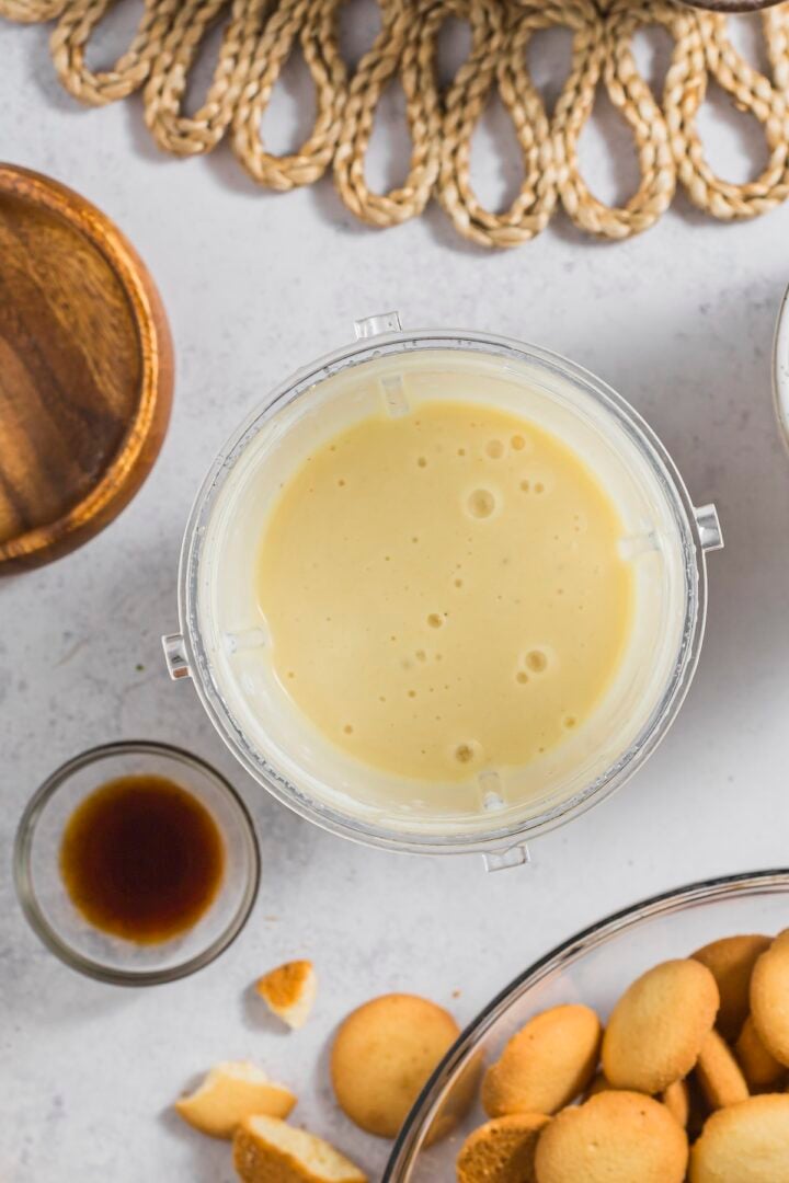 Banana blended with soft tofu in a blender cup.