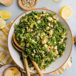 Kale white bean salad tossed in a large mixing bowl.