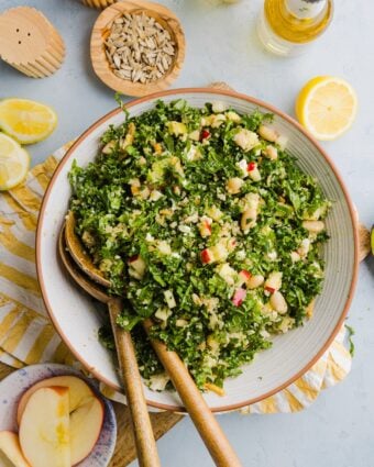 Kale white bean salad tossed in a large mixing bowl.