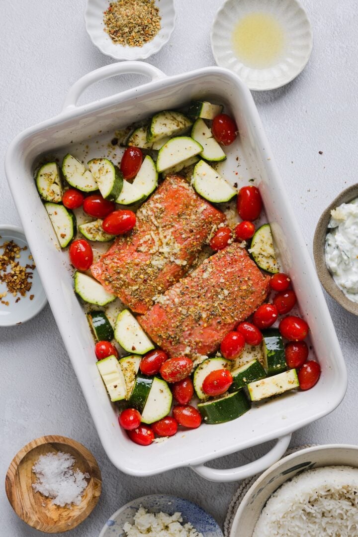 Salmon and vegetables in a large baking dish.