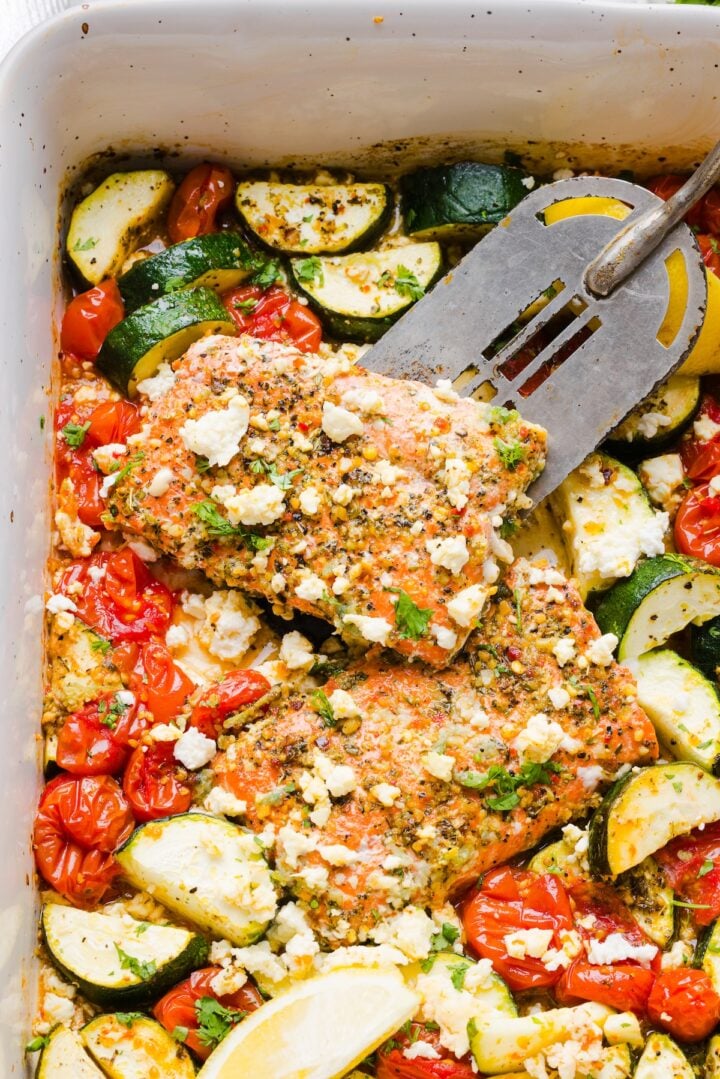 Baked salmon and vegetables in a baking dish.