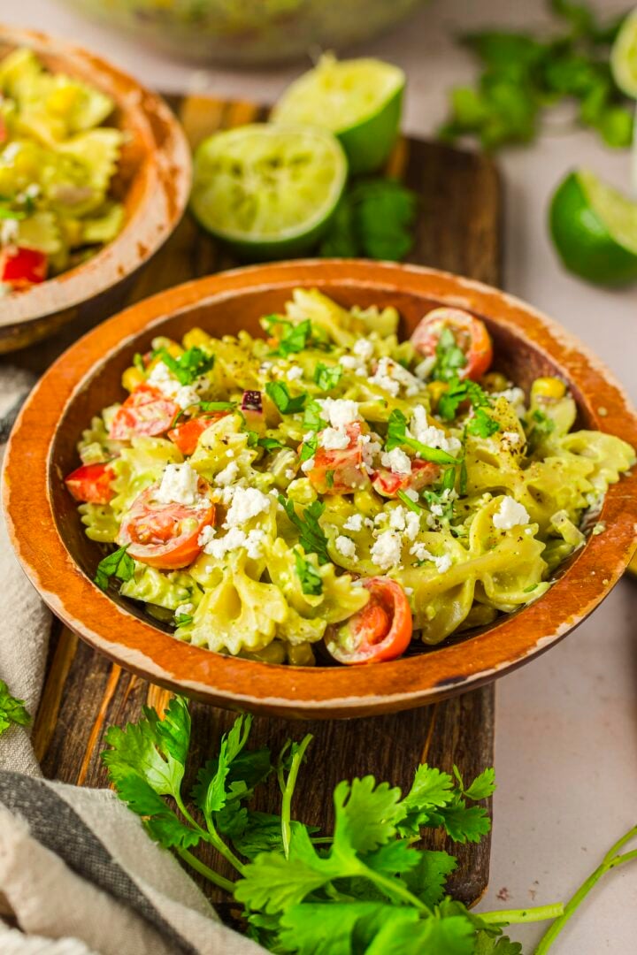 Cilantro lime pasta salad in a wood serving bowl.