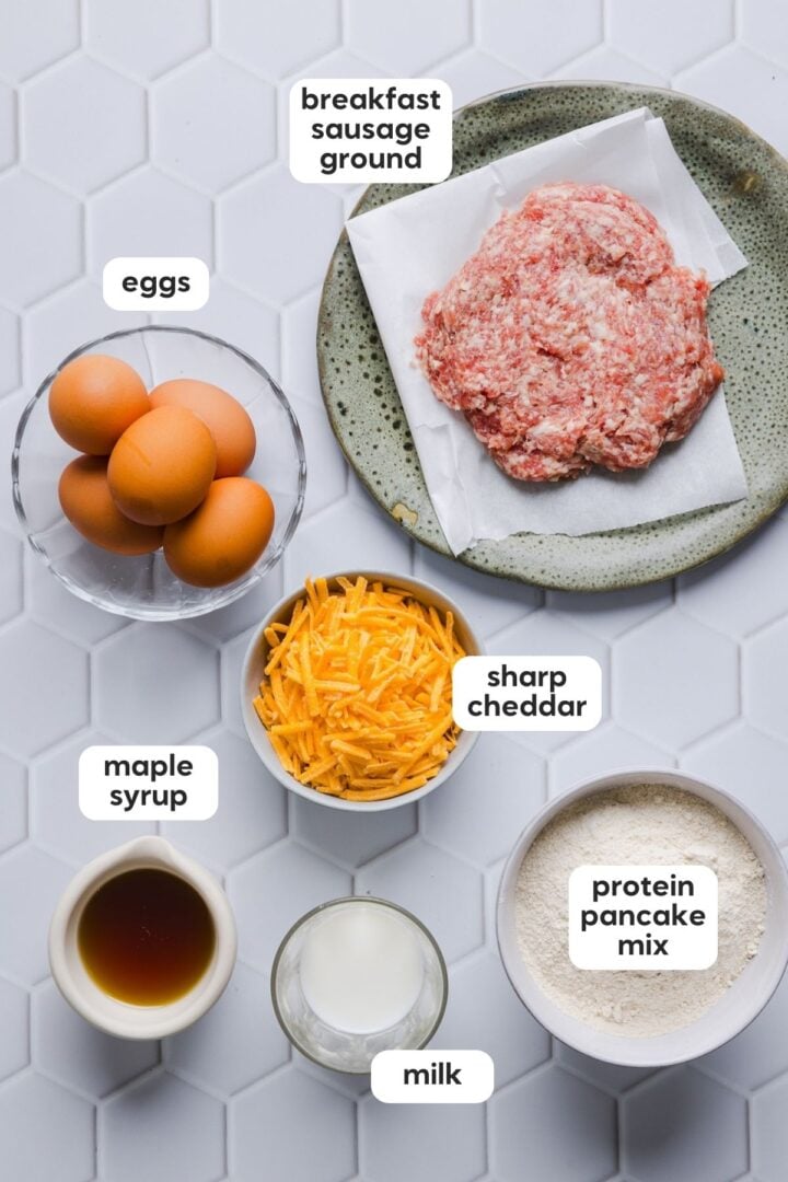 Ingredients for protein mcgriddle muffins displayed in small bowls on a white tile counter.