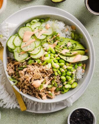 Tuna mayo rice bowl on a green marble kitchen counter.
