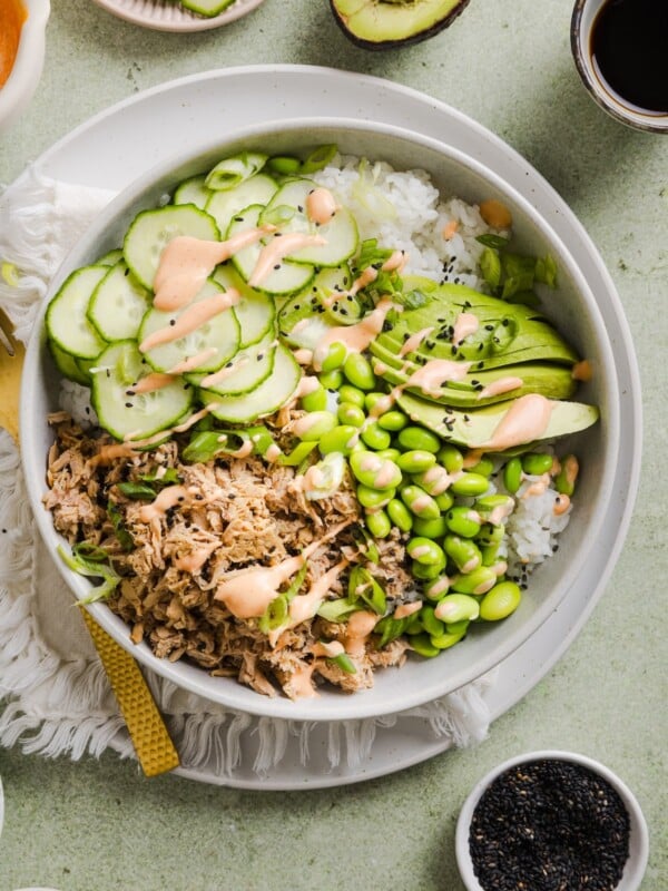 Tuna mayo rice bowl on a green marble kitchen counter.