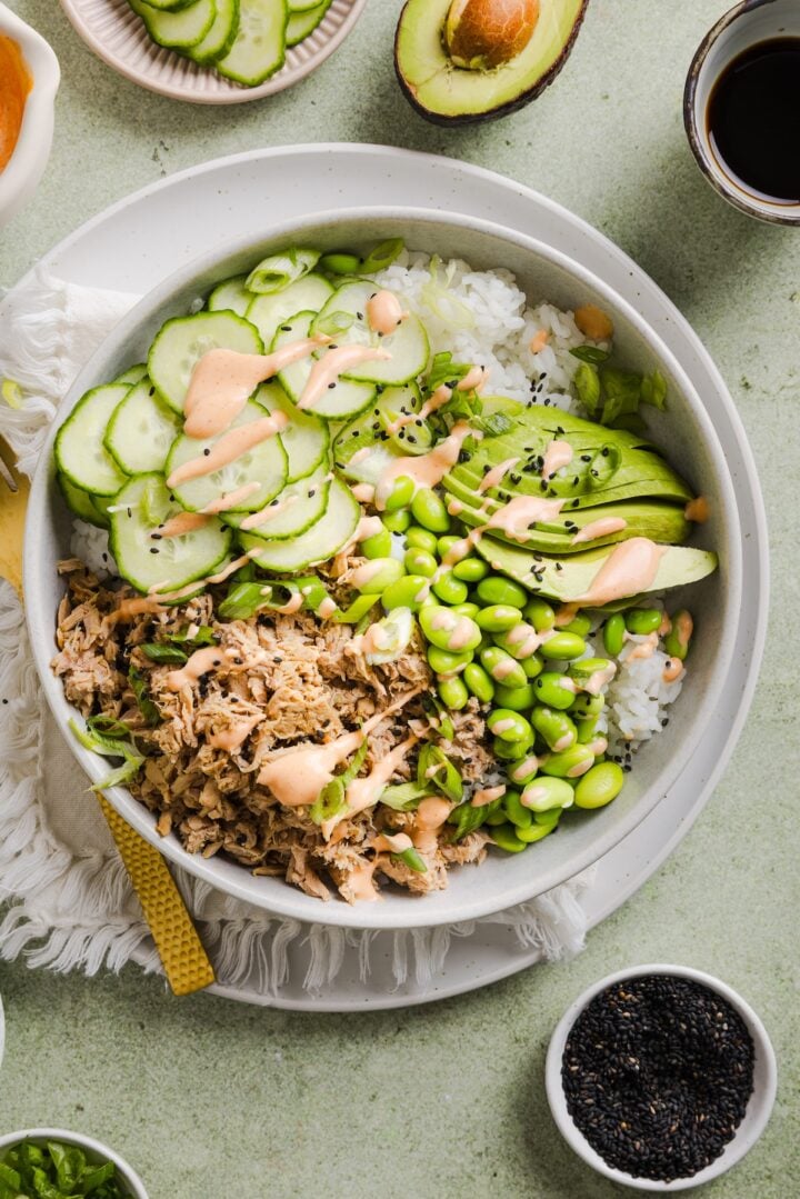 Tuna mayo rice bowl on a green marble kitchen counter.