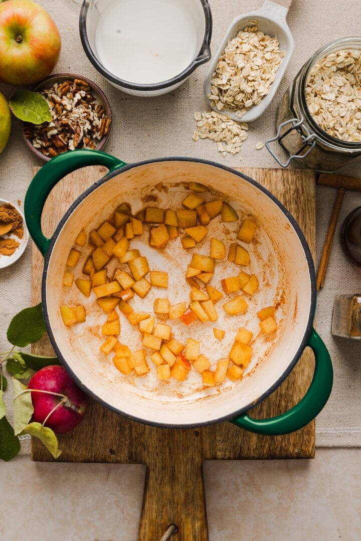 Chopped apples cooked in a small pot.