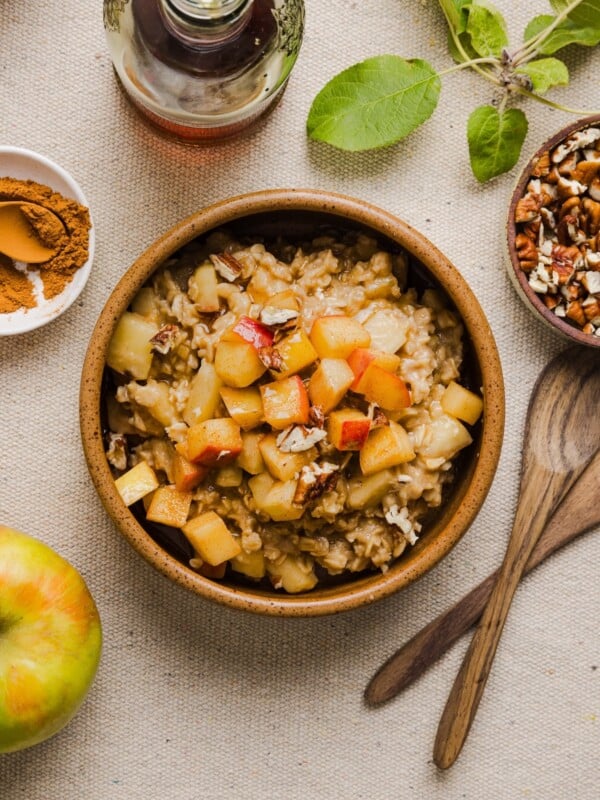 Apple cinnamon oatmeal in a wooden bowl.