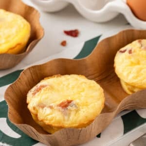 Bacon gruyere egg bites on a white kitchen counter.