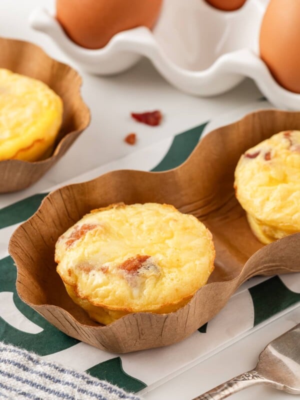 Bacon gruyere egg bites on a white kitchen counter.