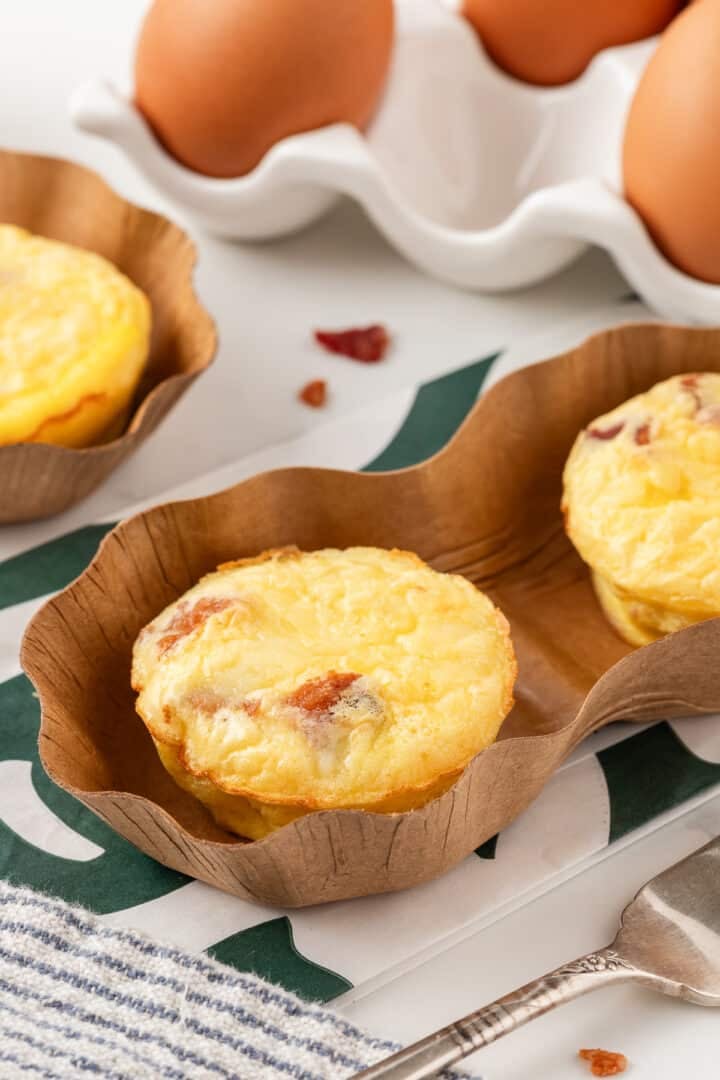 Bacon gruyere egg bites on a white kitchen counter.