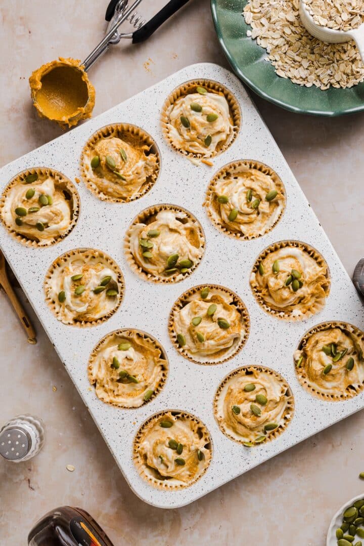 Raw pumpkin cream cheese muffins with pepitas.