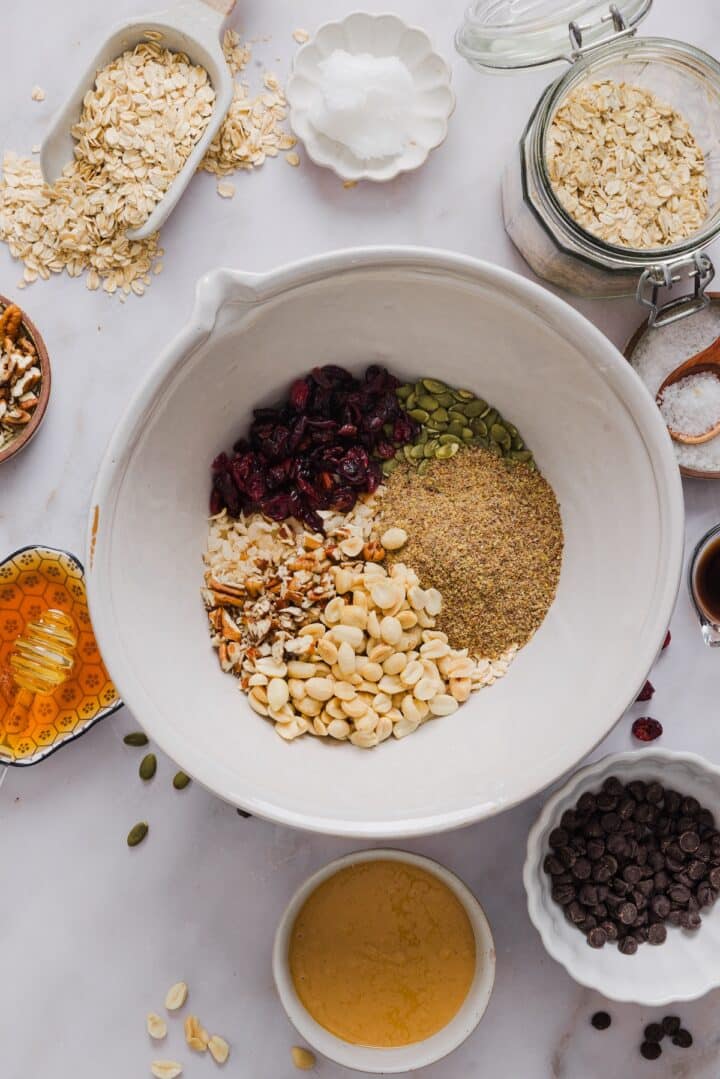 Trail mix ingredients in a large mixing bowl.