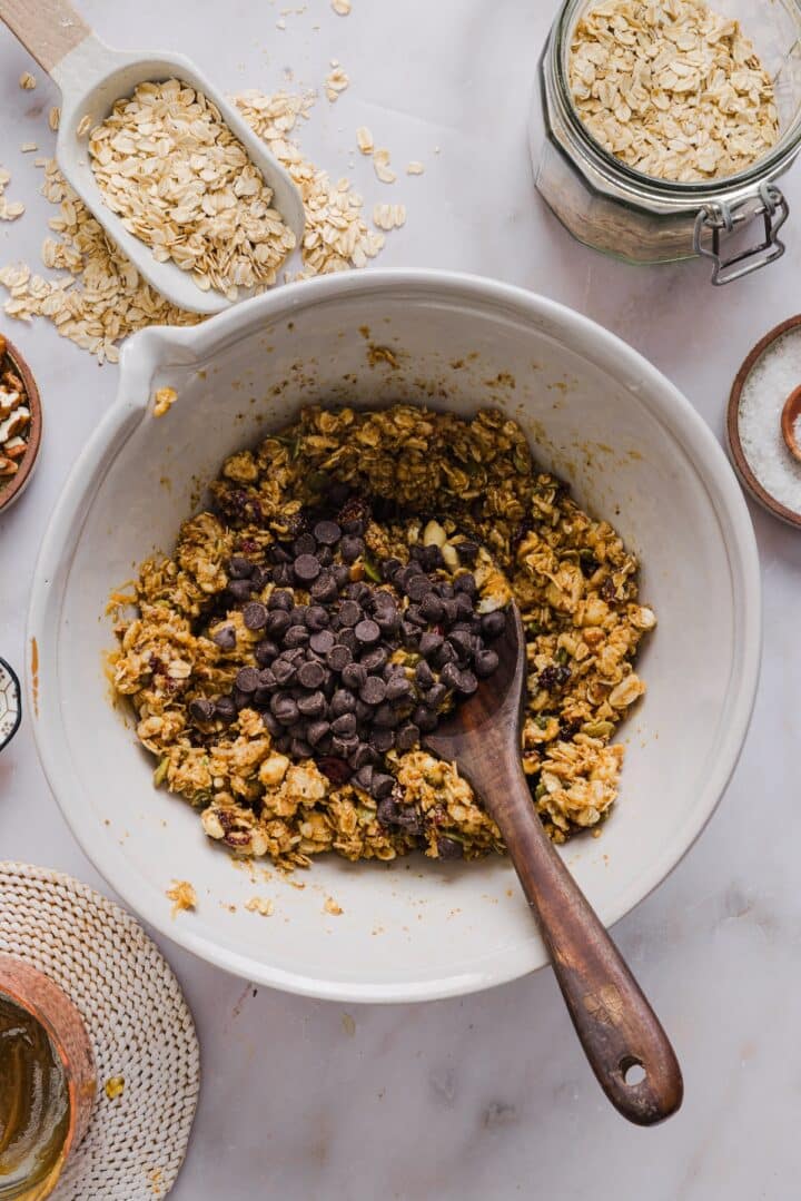 No-bake granola bar dough in a large mixing bowl with chocolate chips.