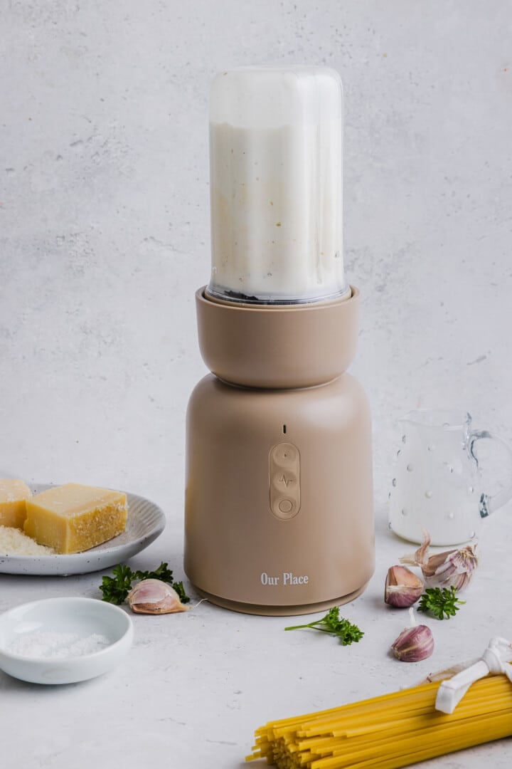 Cottage cheese alfredo blended in a small blender.