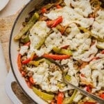 Philly cheesesteak skillet dinner with a serving spoon.