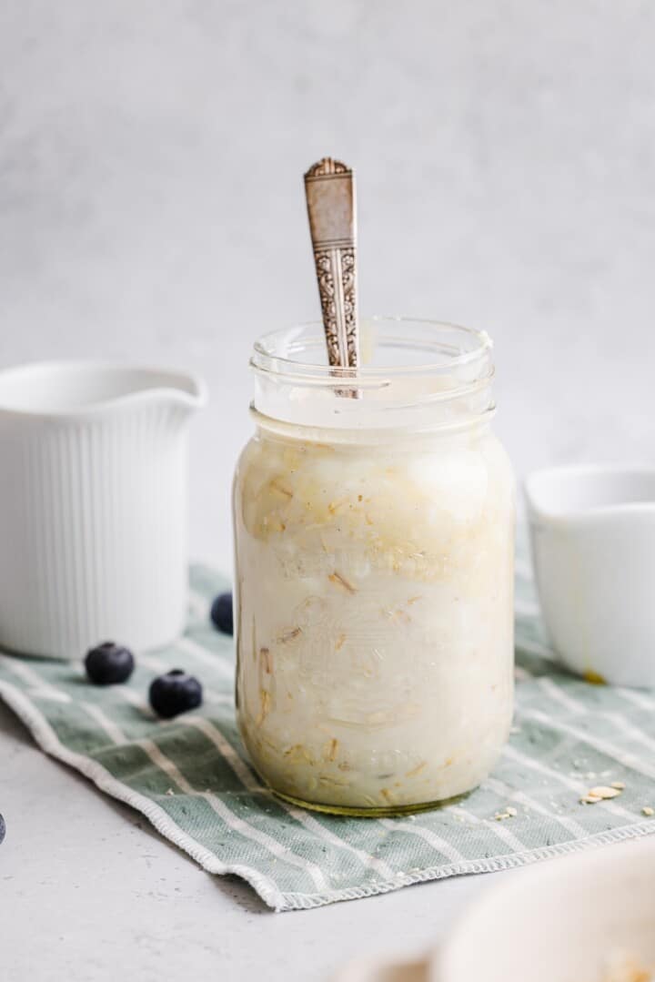 Cottage cheese overnight oats stirred in a glass jar.
